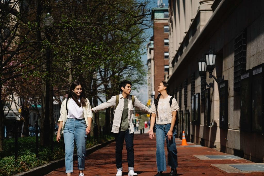 Walking on sidewalk with three people