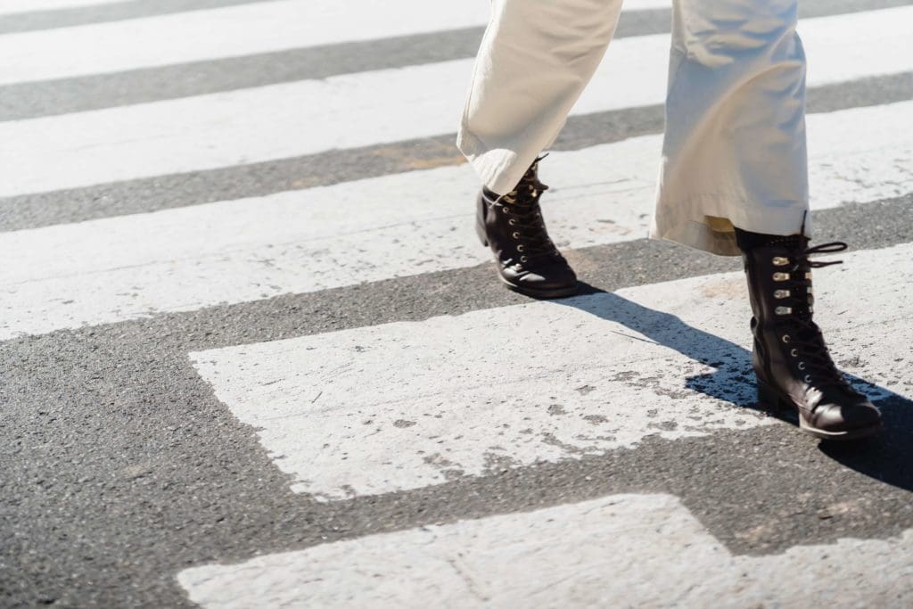 Person crossing at crosswalk - Week Without Driving