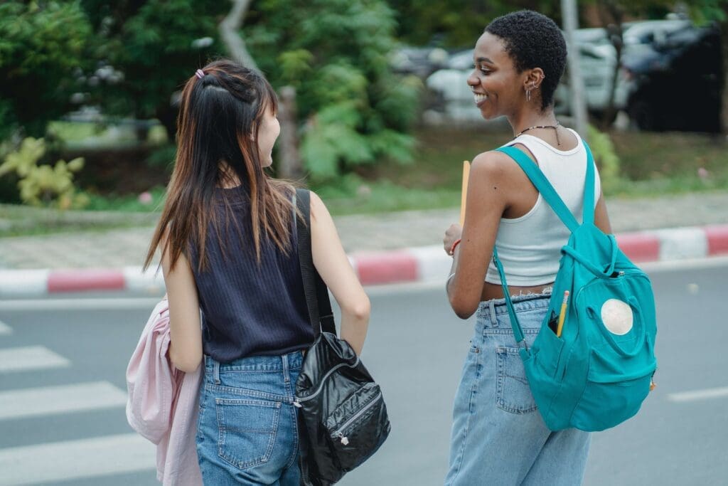 women crossing street