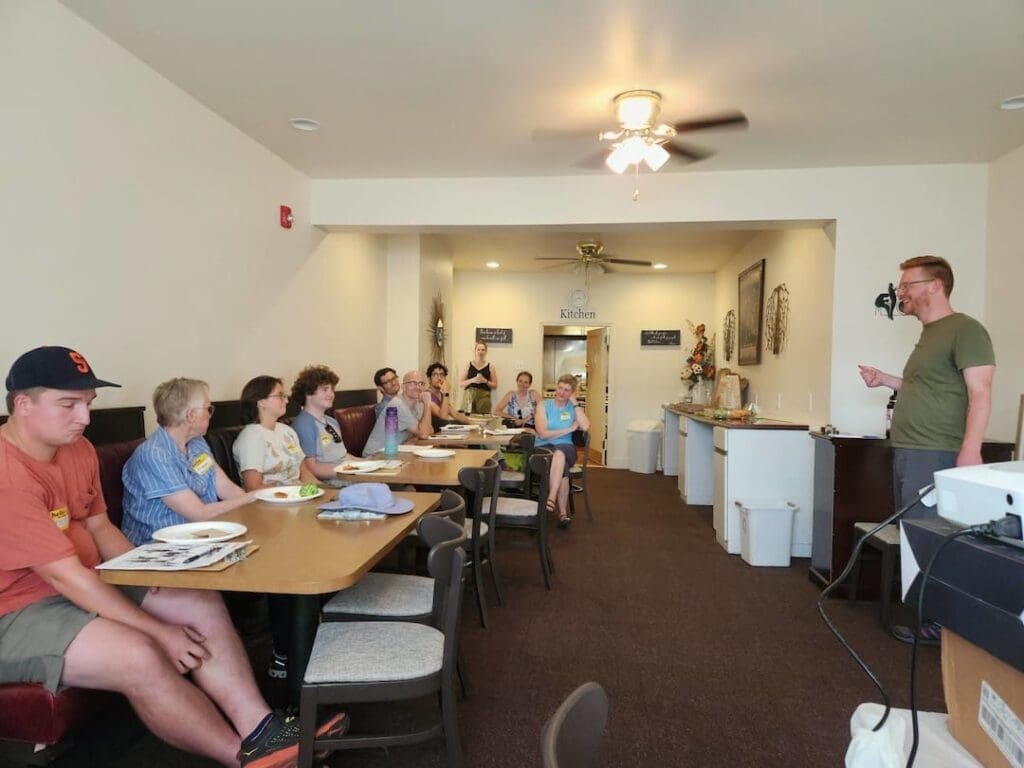 Seth speaking to group of people