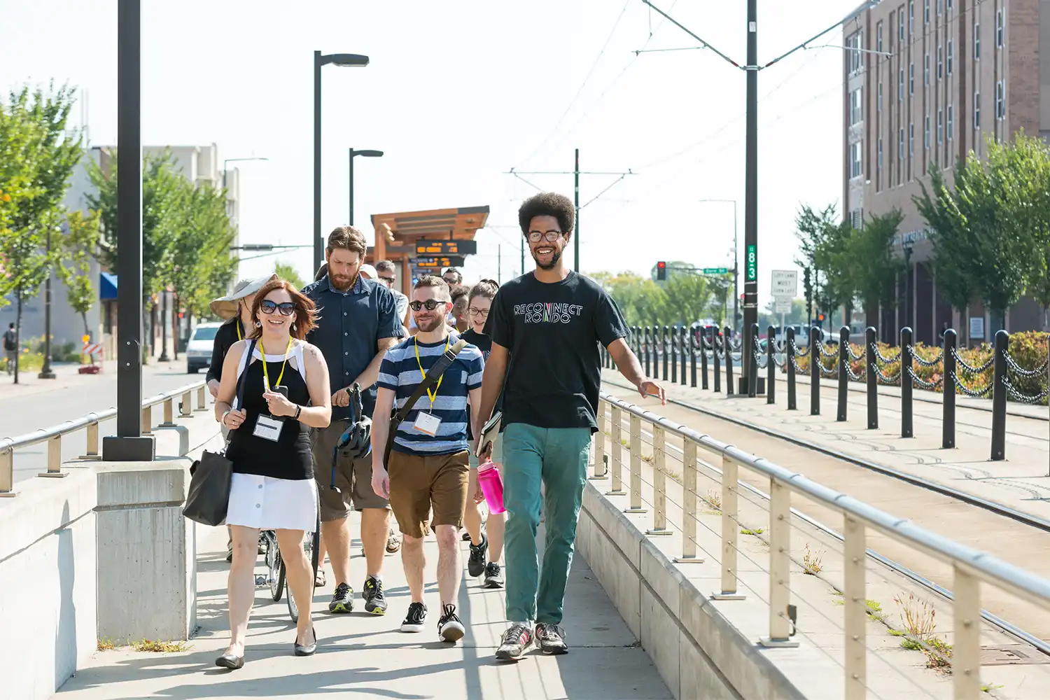 pedestrians walking on a sidewalk together